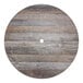 A Grosfillex round wood table top with a hole in the middle.