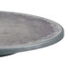 A Grosfillex round zinc resin table with charcoal legs.