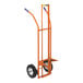 An orange Wesco hand truck with wheels and a white handle.