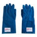 A close-up of a blue Tucker Safety Nomex glove with a white label.