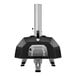 A black and silver Ooni Karu 16 pizza oven on a stand.