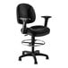 A National Public Seating black office stool with arms and a chrome base.