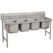 A stainless steel Advance Tabco pot sink with four compartments.