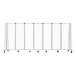 A gray metal mobile room divider with clear acrylic panels and wheels.