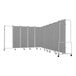 A National Public Seating mobile room divider with 11 gray panels and a gray metal frame on wheels.