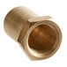 A close-up of a brass threaded nut.