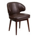 A Flash Furniture brown leather chair with wooden legs.