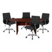 A mahogany oval conference table with four black leather chairs around it.