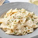 A plate of pasta with Foothill Farms Alfredo sauce and parsley.