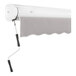 A white awning with a grey shade on it.