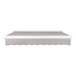 An Awntech gray and white Key West patio awning with protective hood.