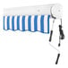 A white rectangular object with a blue and white striped Awntech Key West retractable awning.