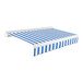 A blue and white striped Awntech Key West patio awning with a protective hood.