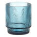 An Acopa Lore blue glass tealight holder with a ribbed design.