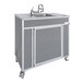 A gray Monsam portable eye and face washing station on wheels.