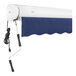 A white and navy Awntech Key West retractable patio awning with a cord and a remote.
