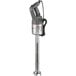 A silver and black Robot Coupe MP450 Turbo VV 18" Variable Speed Immersion Blender being held.