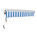 An Awntech Destin blue and white striped retractable patio awning on a wall.