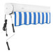 A blue and white striped Awntech Key West retractable patio awning with a cord.