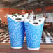 Two blue LK Packaging ReadyFresh paper cold cups on a table.