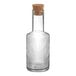 An Acopa Lore clear glass carafe with a cork stopper.