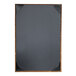 A black menu cover with a brushed metallic gold frame.