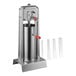 A Tre Spade stainless steel vertical sausage stuffer with a red handle.