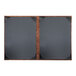 A black rectangular menu cover with a bronze brushed metallic frame.