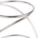 A stainless steel American Metalcraft riser set with a curved metal ring handle.