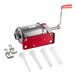 A red and silver Tre Spade manual sausage stuffer with white plastic funnels.