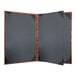 A black menu cover with a wooden frame and bronze metallic accents.