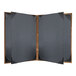 A black rectangular menu cover with a metallic border and wooden corners.