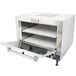 A Nemco countertop pizza oven on a school kitchen counter with the door open.