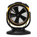 A yellow and black XPOWER FC-100S Pro Air portable air circulator utility fan on a stand.