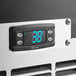 A digital display with a temperature on a Perlick bottle cooler.