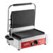 An Avantco commercial panini grill with grooved plates on a table.