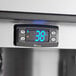 The digital display of a Perlick undercounter refrigerator with blue numbers.