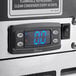 A Perlick 48" Black Glass Froster with a digital display.