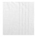 A close-up of a white towel with a textured pattern.