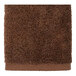 A brown towel with a white border.