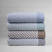 A stack of three folded blue chevron Fibertone pool towels.