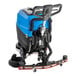 A blue and black Lavex walk behind floor scrubber with a hose.