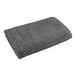 A grey 1888 Mills hand towel on a white background.
