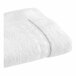 A white 1888 Mills Magnificence Pima cotton bath mat with a stitched edge.