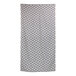 A grey and white 1888 Mills pool towel with a diamond pattern.