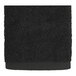 An Onyx 1888 Mills hand towel with a white border.