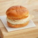 A Grand Prairie Buffalo chicken sandwich on a wooden surface.