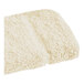 A beige Fibertone washcloth with a fluffy edge.