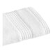 A 1888 Mills white washcloth with a stitched edge.