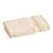A close-up of a white 1888 Mills Magnificence Pima cotton washcloth.